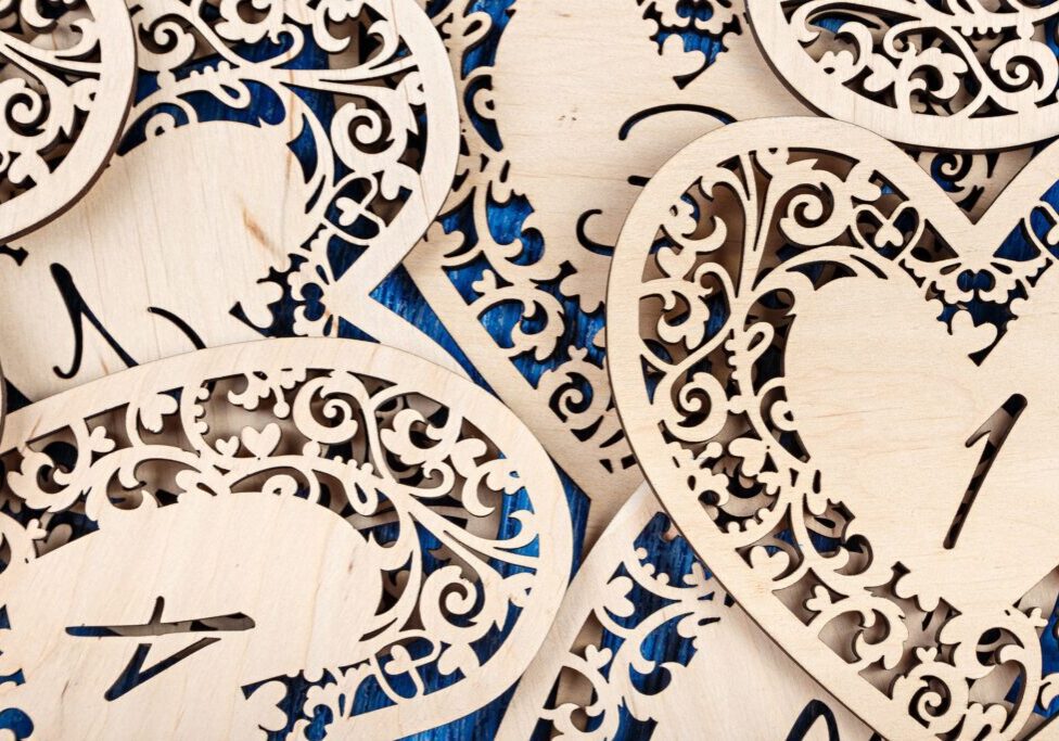 Intricate wooden heart-shaped cutouts with numbers.